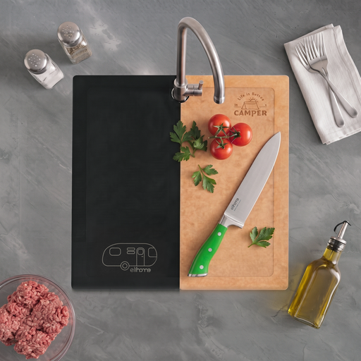 Raw steak, a chef's knife, and fresh herbs on an Elihome Camper Series board covering an RV kitchen sink