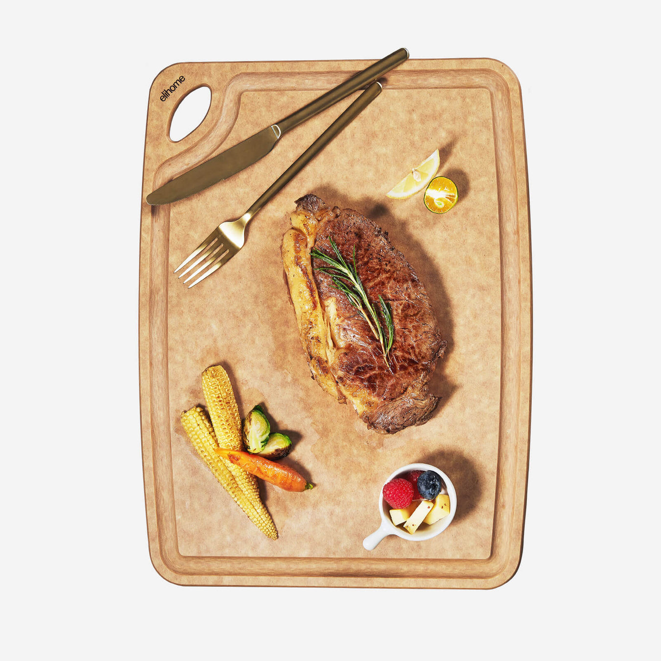 Elihome Classic Series 10x13 inch wood fiber cutting board with grilled steak and roasted vegetables