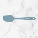 Blue spatula on a marble background