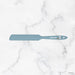 Blue spatula with 'elhome' branding on a marble background