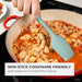 Person stirring a dish of chicken and mushrooms in a red pot with a green spatula, text indicating non-stick cookware compatibility.