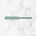 Green spatula with 'elihave' branding on a marble background