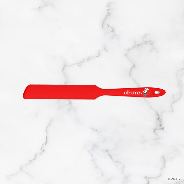 Red spatula with 'elithe' branding on a white marble background