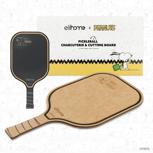 Pickleball paddle and cutting board with 'elihome x Peanuts' branding on a light background